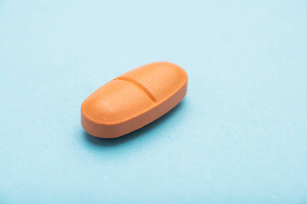 Pills on a colored background. Healthcare and medicine concept