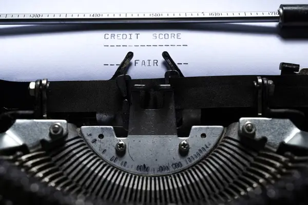Text of CREDIT SCORE typed on a vintage typewriter. Financial concept