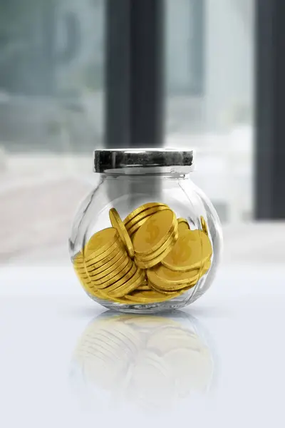Golden Coins Glass Jar White Table Blurred Background Financial Concept — Foto Stock