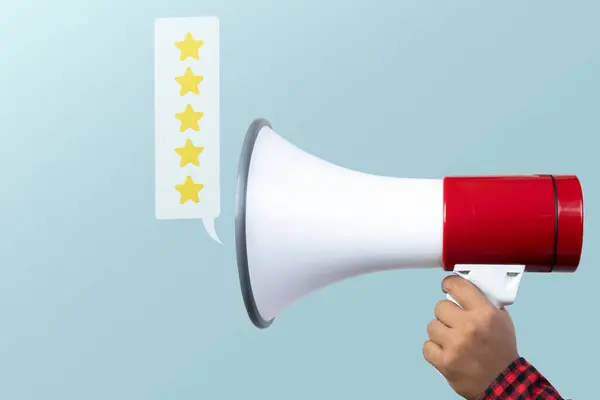 Human hand holding megaphone with a five-star rating symbol. Business and service concept