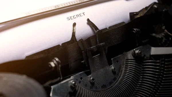 Text of secret typed on a vintage typewriter. Secret concept
