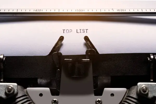 Text of top list typed on a vintage typewriter. Business concept