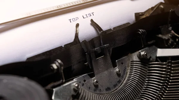 Text of top list typed on a vintage typewriter. Business concept