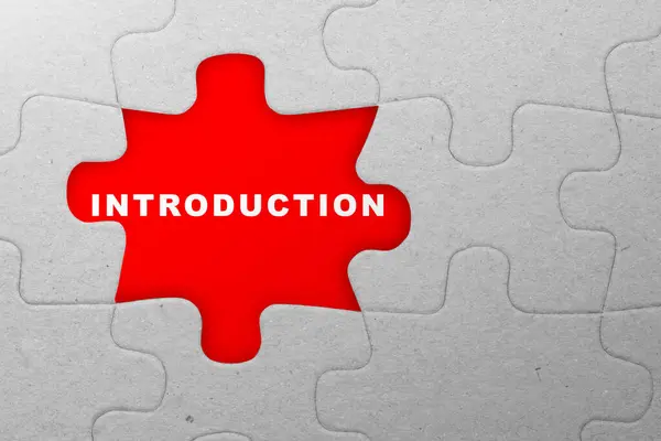 Piece of missing jigsaw puzzle with introduction text over red background. Introduction concept