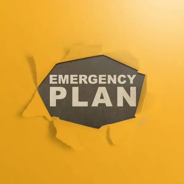 Ripped paper with \'Emergency plan\' text with a black background. Emergency action plan concept