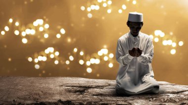 Müslüman bir adam oturmuş, ellerini kaldırmış ve Allah 'a dua ediyordu. Müslüman kavramı