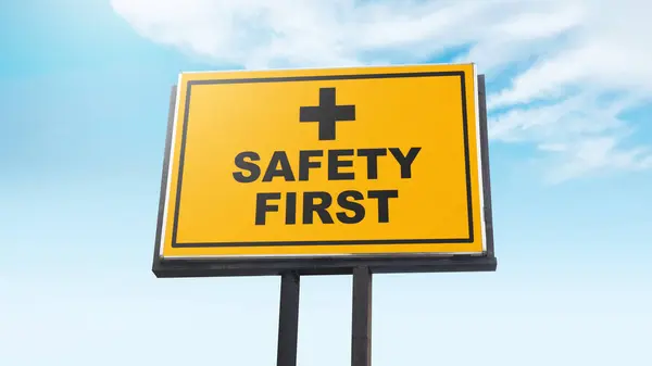 Safety first with yellow sign on blue sky background as a warning concept of industrial attention for employee awareness. Business concept for Avoid any unnecessary risk live safely and healthcare attention