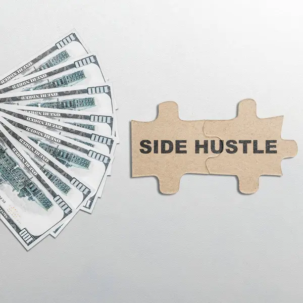 Text of side hustle on puzzle with dollars money on the next isolated over white background. Side hustle income payment concept. Freelance idea for more job or income.