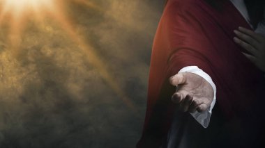 Yüce İsa parlak bir arka planda yardım elini uzatıyor. Hıristiyan konsepti