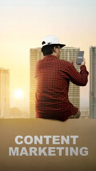 People in hats sit with content marketing text while using mobile phones with cityscapes background. Content manager, strategy and creativity concept