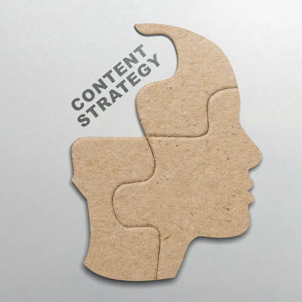 The missing piece of the brain puzzle with content strategy text on a white background. Content manager, strategy and creativity concept
