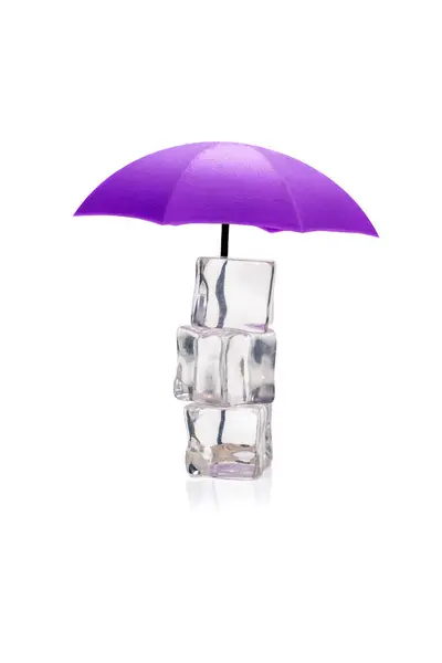 stock image Purple umbrella is protecting a precarious stack of three melting ice cubes, suggesting a concept of global warming or climate change