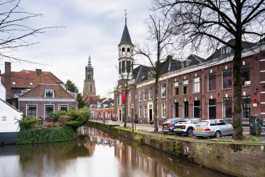 Cityscapes of the medieval town with canal, medieval house, and Onze Lieve Vrouwetoren (Church tower) view on Amersfoort, Netherlands. Architecture, travel background or wallpaper clipart