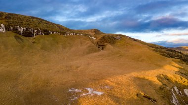 Aerial landscape view of hill range beside Fjadrargljufur Canyon in Iceland. Taken by drone. Nature, travel, winter background, or wallpaper clipart