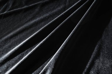 Buruşuk desenli siyah saten ipekten. Malzeme tekstil yüzeyi. Boşluğu kopyala
