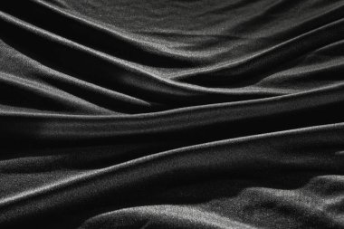 Buruşuk desenli siyah saten ipekten. Malzeme tekstil yüzeyi. Boşluğu kopyala