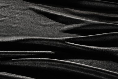 Buruşuk desenli siyah saten ipekten. Malzeme tekstil yüzeyi. Boşluğu kopyala