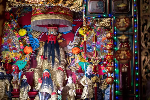 stock image Thailand, August 11, 2024, Guan Yu Shrine (Khlong San), Colorful altar featuring ornate statues, intricate decorations, and vibrant artwork in a temple setting during a festive celebration