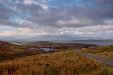 The Isle of Arran on a cold hazy day in October looking over from Dalry Moor Road and the Fishery Arran bathed in evening sunlight