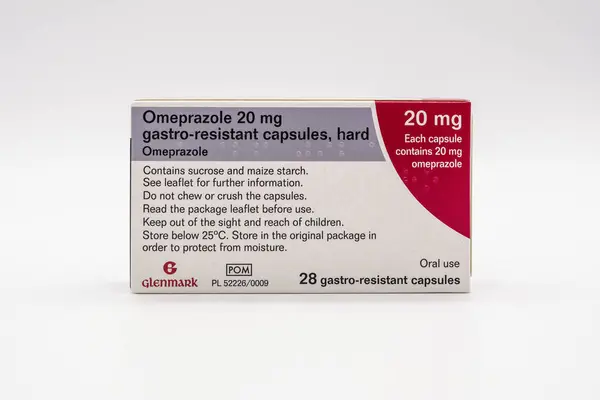 stock image Irvine, Scotland, UK - June 17, 2024: Omeprazole 20mg gastro resistant hard capsules by the Glenmark Pharmacy (EU) brand in a braille facilitated cardboard box with foil sleeves displaying graphics icons and general information relevant to the image 