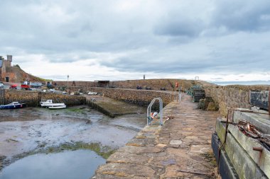  Looking up to the harbour lamps of Crail harbour on the east coast of Scotland clipart