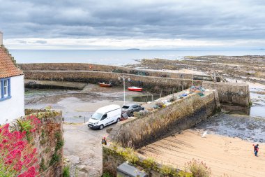 Crail, Scotland, UK - July 10, 2024: Coastal footpath leading down to Crail harbour on the east coast of Scotland clipart