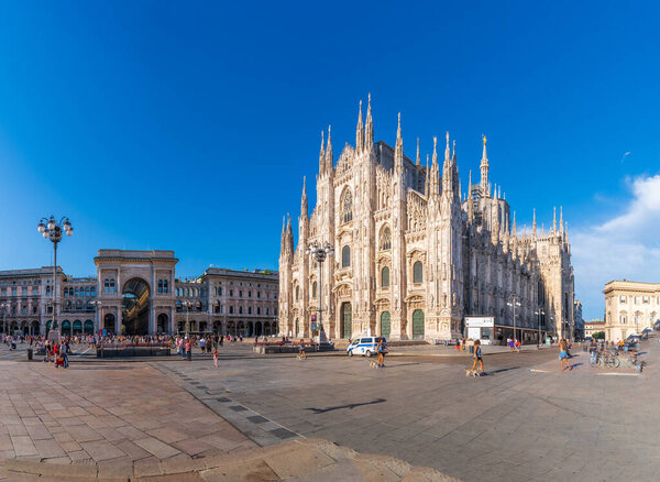 MILAN, ITALY - AUGUST 1, 2021: Famous Duomo cathedral. The cathedral took nearly six centuries to complete: construction began in 1386, and the final details were completed in 1965. It is the largest church in the Italian Republic