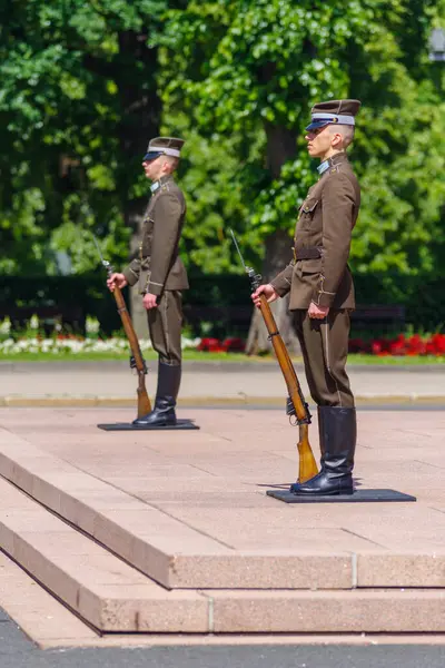 stock image RIGA, LATVIA - JUNE 16, 2024: Guard of honour in front of the national freedom monument consisting of two unknown soldiers. 