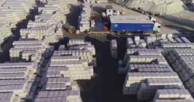 Warehouse of finished products near the factory. Large outdoor warehouse. Large warehouse near the factory.