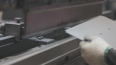 A man works for the machine. Asian man working on a hydraulic machine.