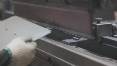 A man works for the machine. Asian man working on a hydraulic machine.