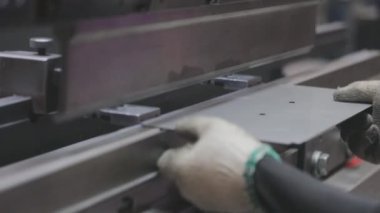 A man works for the machine. Asian man working on a hydraulic machine.