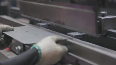 A man works for the machine. Asian man working on a hydraulic machine.