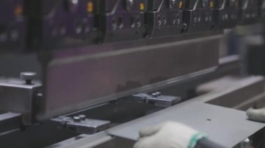 A man works for the machine. Asian man working on a hydraulic machine.