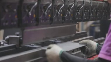 A man works for the machine. Asian man working on a hydraulic machine.