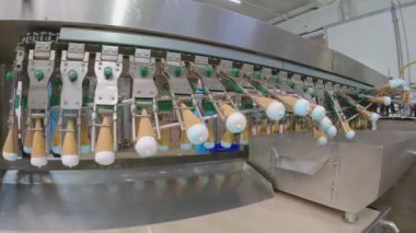 Ice cream on the conveyor line. Ice cream cone on the conveyor. Automated ice cream production line.