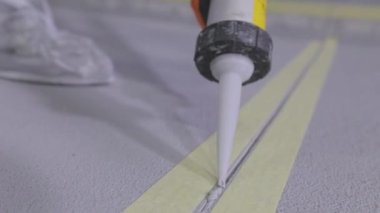 Builders make a paving on the parking lot. The process of creating a self-leveling floor. Parking construction.