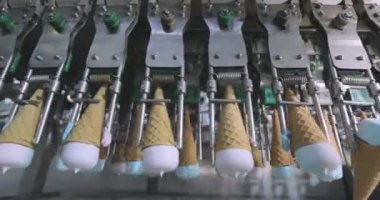 Ice cream on the conveyor line. Ice cream cone on the conveyor. Automated ice cream production line.