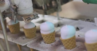 Ice cream on the conveyor line. Ice cream cone on the conveyor. Automated ice cream production line.