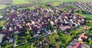 Church in the center of a small town drone view. Flight over a beautiful European city. European village aerial view.