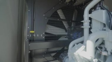 Detailed shot of diesel generator engine. Diesel electric generator engine close-up. Industrial diesel power generator close-up.