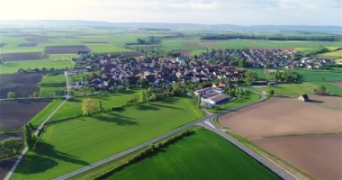 Church in the center of a small town drone view. Flight over a beautiful European city. European village aerial view.