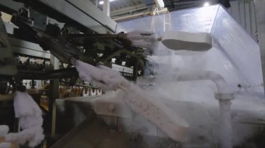 Freezing ice cream on the conveyor. Ice cream production process. Conveyor at the ice cream factory.