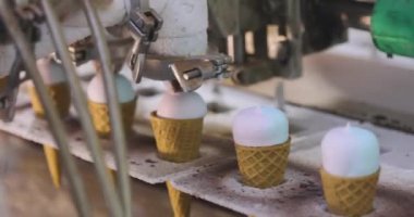Ice cream on the conveyor line. Ice cream cone on the conveyor. Automated ice cream production line.