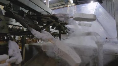 Freezing ice cream on the conveyor. Ice cream production process. Conveyor at the ice cream factory.