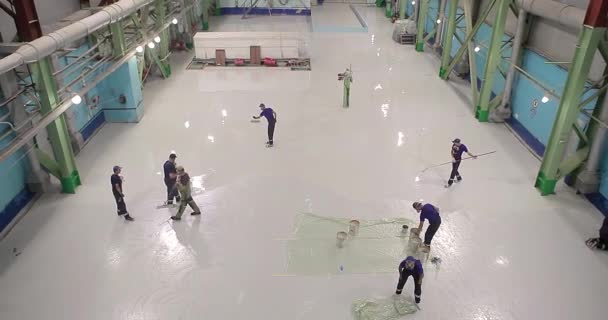 Builders Apply Polymer Coating Floor Industrial Building Team Professionals Makes — Stock Video