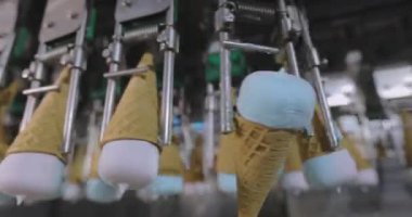 Ice cream on the conveyor line. Ice cream cone on the conveyor. Automated ice cream production line.