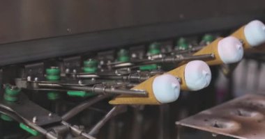 Ice cream on the conveyor line. Ice cream cone on the conveyor. Automated ice cream production line.