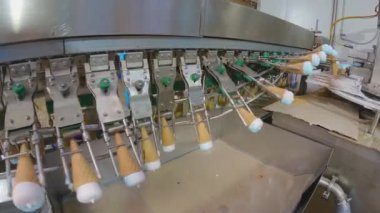 Ice cream on the conveyor line. Ice cream cone on the conveyor. Automated ice cream production line.