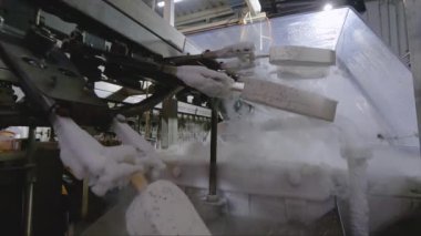 Freezing ice cream on the conveyor. Ice cream production process. Conveyor at the ice cream factory.